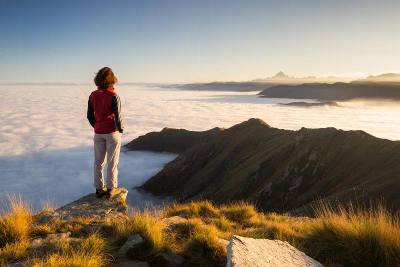 Woman resting on the mountain top