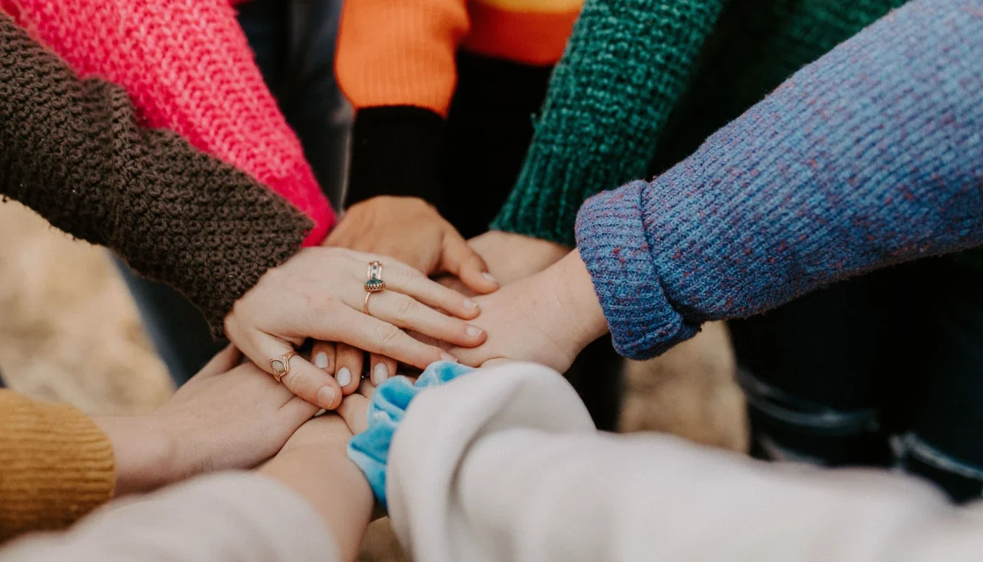 Sylibi - group of women joining hands